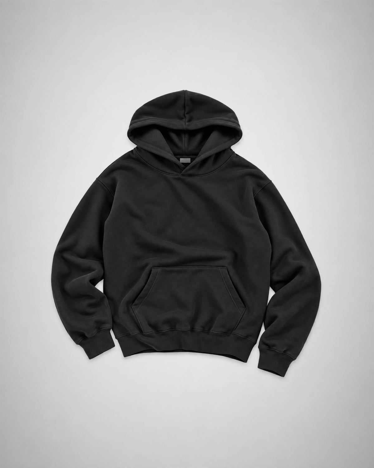 Front view of black COLORS+STUDIOS pullover hoodie with hood and kangaroo pocket.