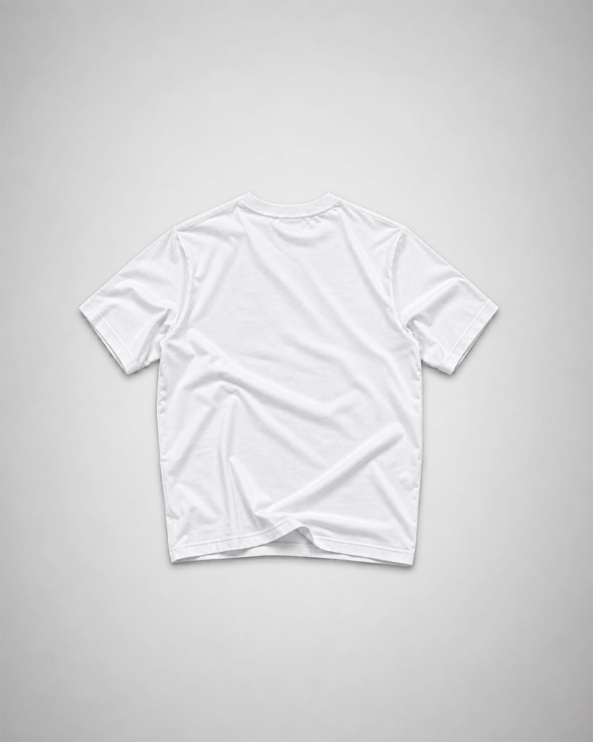 Back view of a plain white COLORS+STUDIOS T-shirt with a clean, minimal design.
