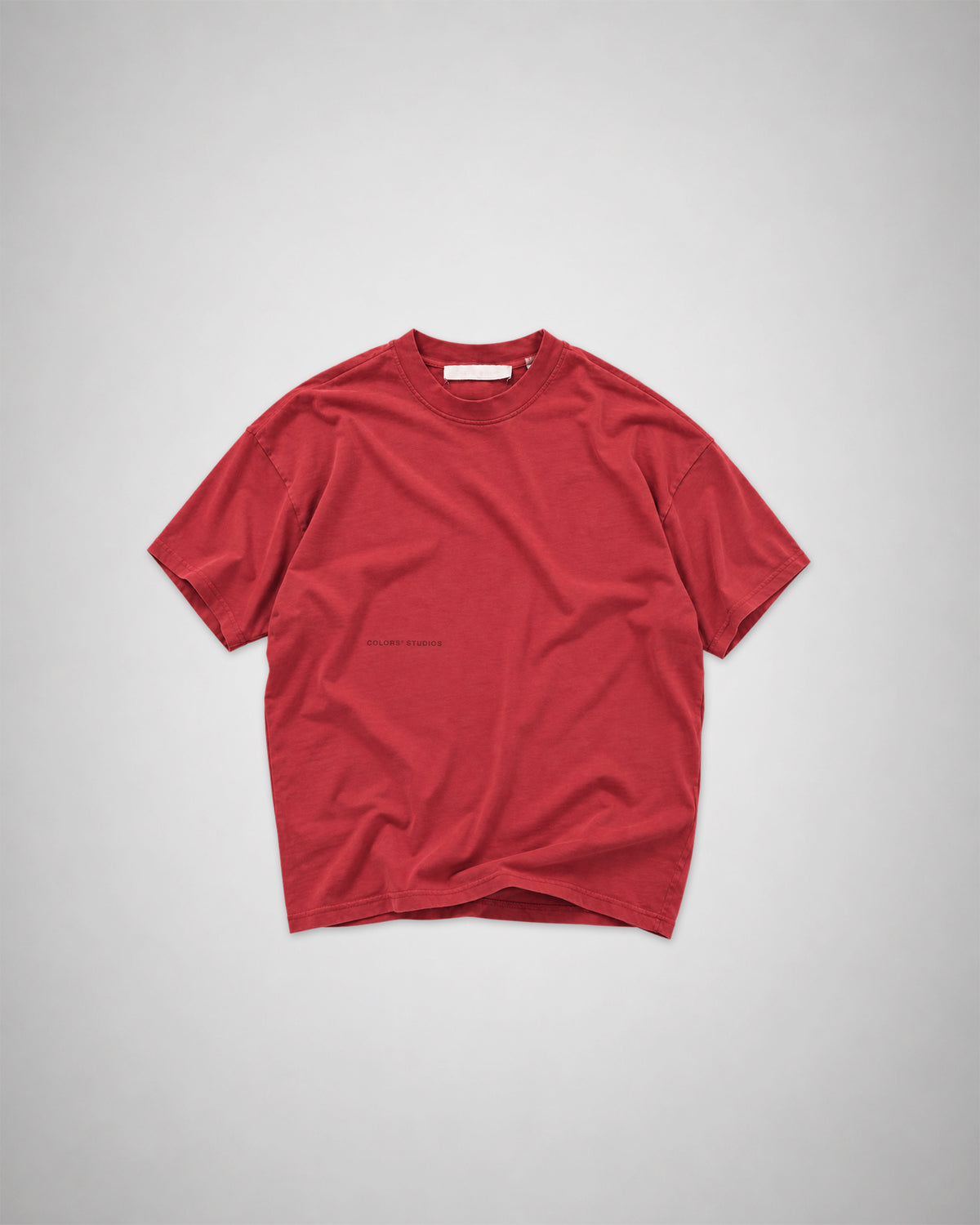 Front view of the COLORS Mic T-Shirt in Sundown red laid flat – heavyweight cotton tee with a tonal COLORS print