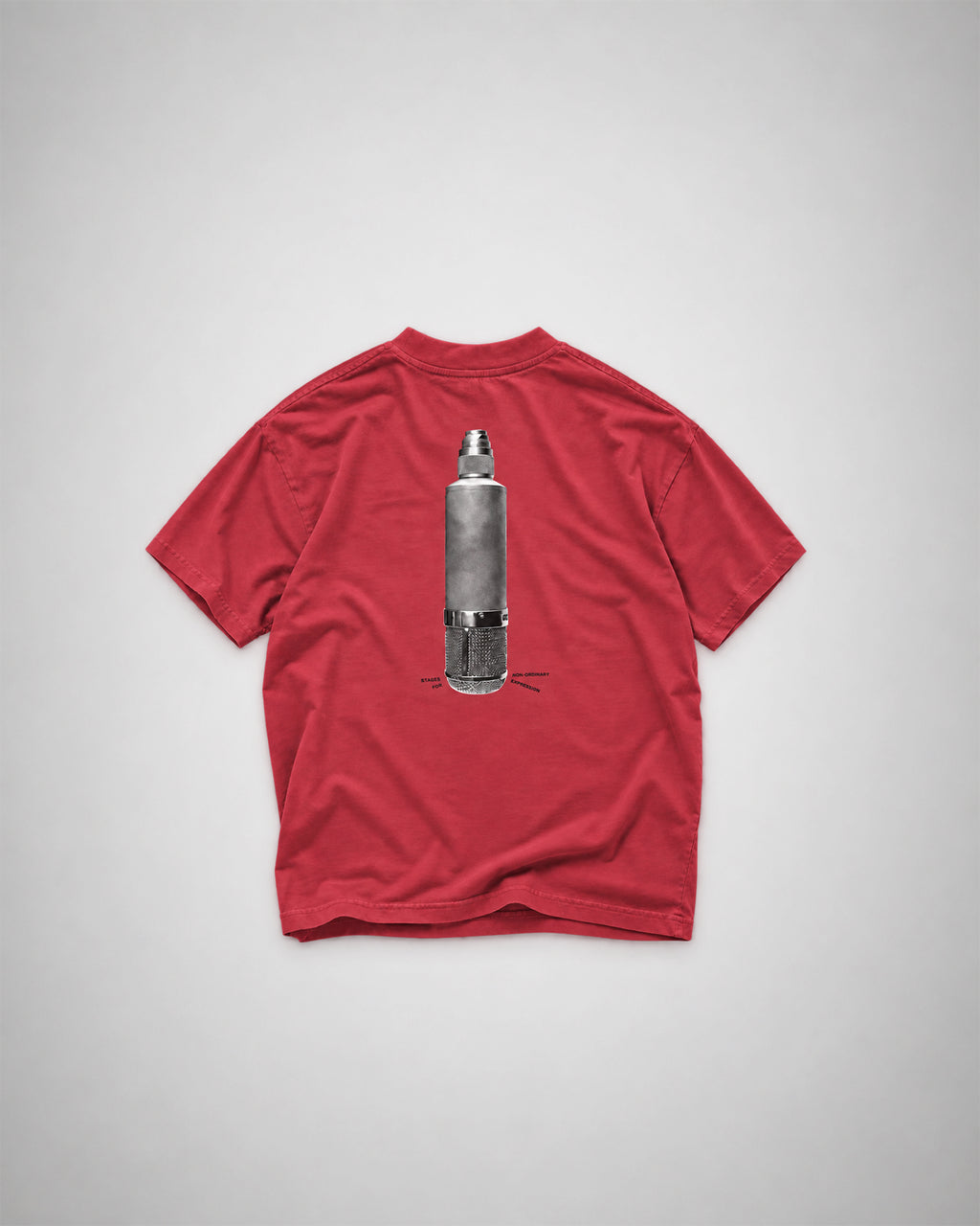 COLORS Mic T-Shirt in Sundown red, back view laid flat – halftone print of a vintage studio microphone with the line "Stages for non-ordinary expression"