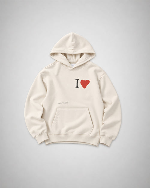 COLORS I Love Hoodie in Pearl Canvas, front view laid flat – off-white cotton hoodie with an "I" and red heart screen print on the chest