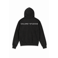 Black hoodie with hood and large white “COLORS * STUDIOS” logo print on the back.