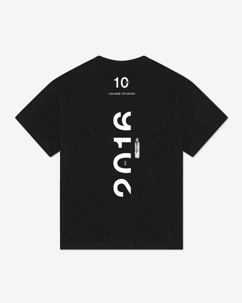 Black crewneck T-shirt featuring a minimalist white “2016” logo on the upper chest with “Colors Studios” in smaller text below.